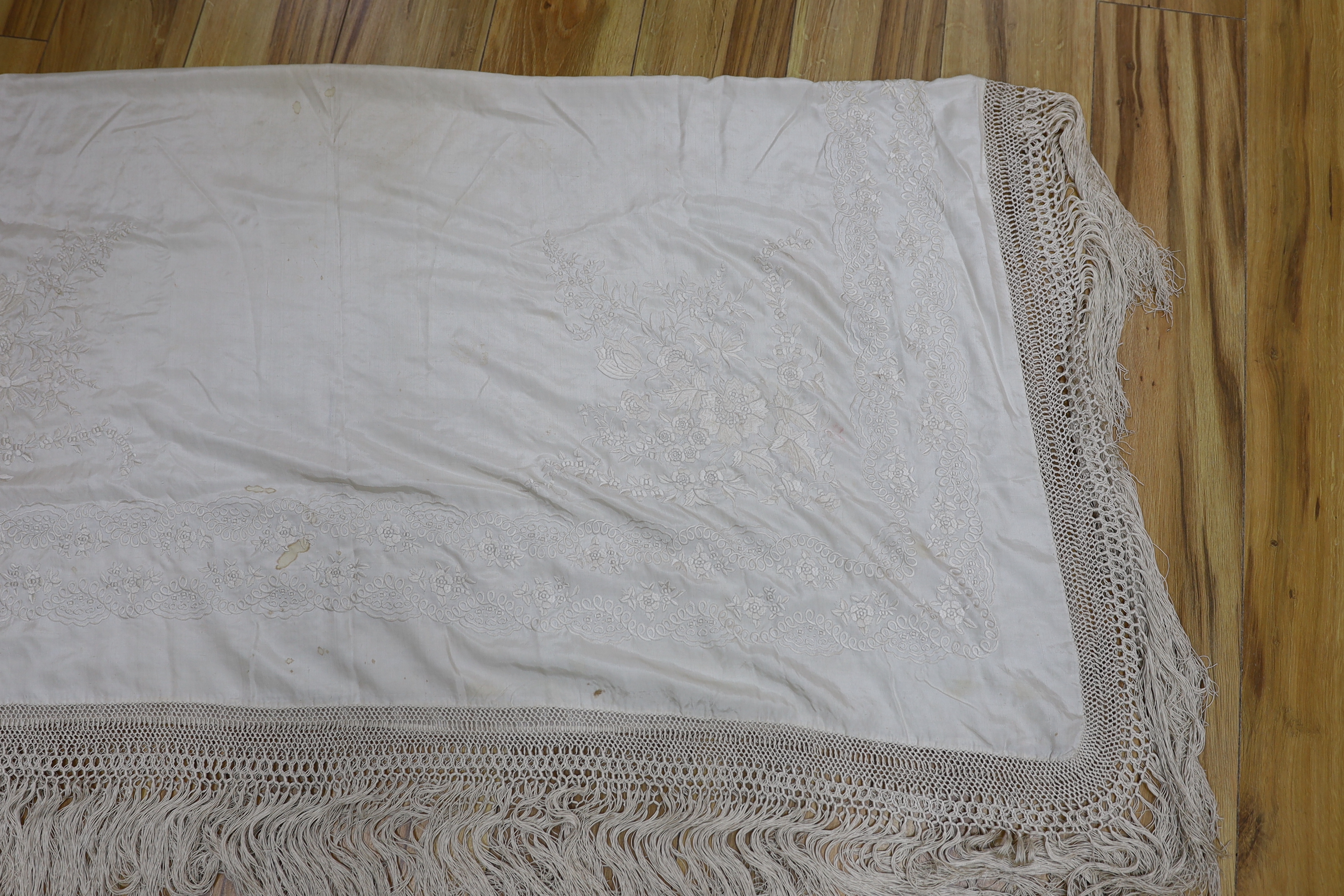 A Canton cream silk embroidered shawl, 136cm x 138cm